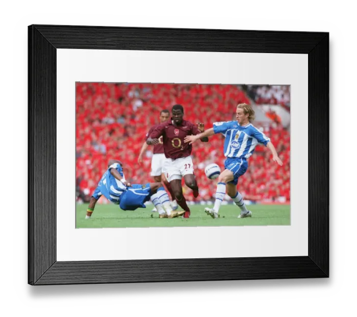 Framed Print : Emmanuel Eboue (Arsenal) Henri Camara and Reto Ziegler (Wigan) Framed Print : Emmanuel Eboue (Arsenal) Henri Camara and Reto Ziegler (Wigan)