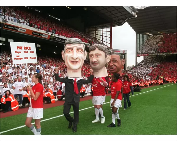 The Arsene Wenger and Tony Adams giant heads on the pitch during the final salute parade