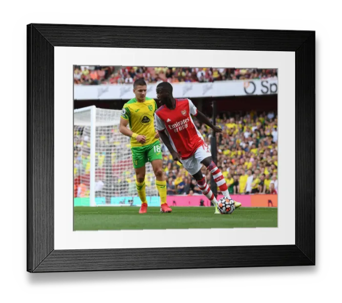 Framed Print : Arsenal vs Norwich City: Pepe Clashes with Tzolis in Premier League Showdown Framed Print : Arsenal vs Norwich City: Pepe Clashes with Tzolis in Premier League Showdown
