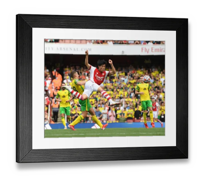Framed Print : Tomiyasu's Debut Shines: Arsenal's Dominant Win Against Norwich City, Premier League 2021-22