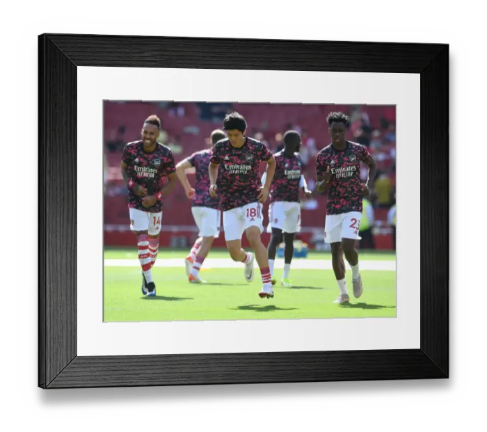 Framed Print : Arsenal's Tomiyasu Warming Up Ahead of Arsenal v Norwich City (2021-22) Framed Print : Arsenal's Tomiyasu Warming Up Ahead of Arsenal v Norwich City (2021-22)
