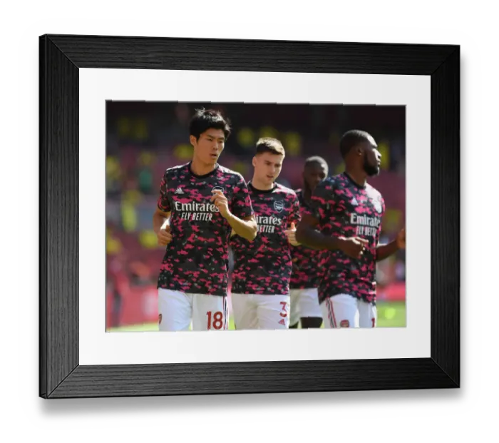 Framed Print : Arsenal's Tomiyasu Gears Up: Arsenal vs Norwich City, Premier League 2021-22
