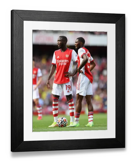 Framed Print : Arsenal's Pepe and Maitland-Niles in Action against Norwich City (2021-22) Framed Print : Arsenal's Pepe and Maitland-Niles in Action against Norwich City (2021-22)