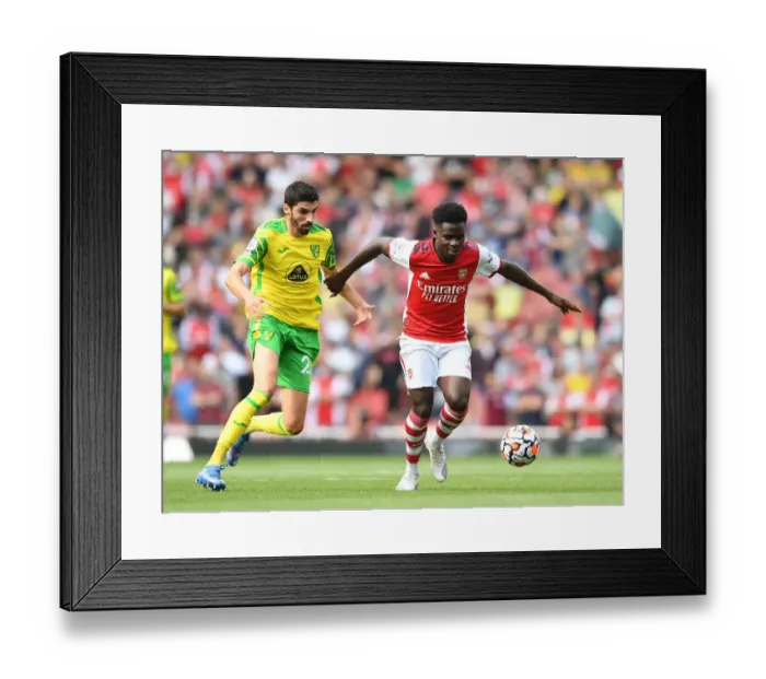Framed Print : Saka vs Lees-Melou: A Premier League Battle at the Emirates
