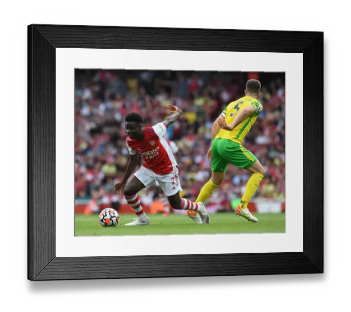 Framed Print : Arsenal's Bukayo Saka Dodges Norwich's Hanley in Thrilling 2021-22 Premier League Clash Framed Print : Arsenal's Bukayo Saka Dodges Norwich's Hanley in Thrilling 2021-22 Premier League Clash