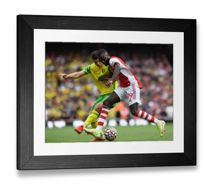 Framed Print : Arsenal's Pepe Fends Off Norwich's Rashica in Premier League Clash Framed Print : Arsenal's Pepe Fends Off Norwich's Rashica in Premier League Clash