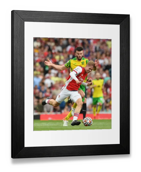 Framed Print : Arsenal's Emile Smith Rowe Clashes with Norwich's Grant Hanley in Premier League Showdown