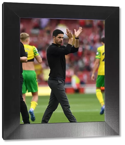 Arsenal's Mikel Arteta Celebrates with Fans after Win against Norwich City (2021-22)
