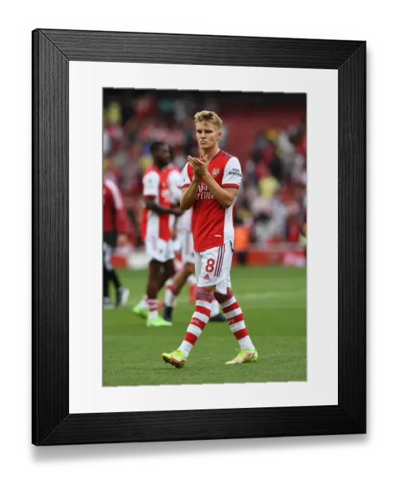 Framed Print : Martin Odegaard's Euphoric Celebration with Arsenal Fans: Triumph over Norwich City Framed Print : Martin Odegaard's Euphoric Celebration with Arsenal Fans: Triumph over Norwich City