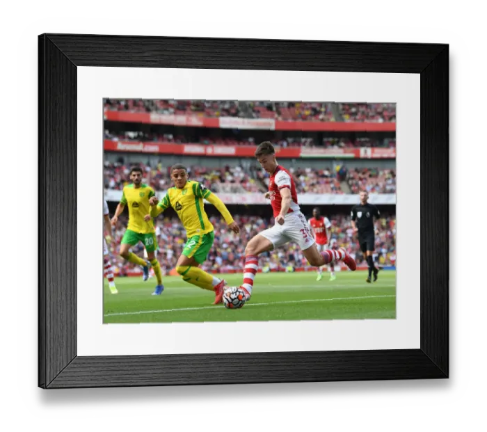 Framed Print : Arsenal's Kieran Tierney Faces Off Against Norwich's Max Aarons in Premier League Clash Framed Print : Arsenal's Kieran Tierney Faces Off Against Norwich's Max Aarons in Premier League Clash