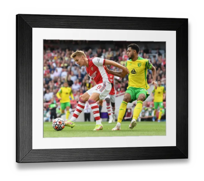 Framed Print : Arsenal vs Norwich City: Martin Odegaard Faces Off Against Omobamidele in Premier League Clash