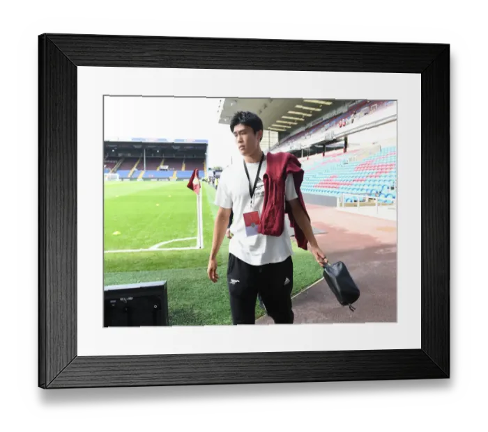 Framed Print : Arsenal's Tomiyasu Arrives at Turf Moor Ahead of Burnley Clash - Premier League 2021-22