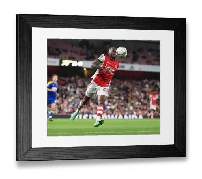 Framed Print : Arsenal's Nuno Tavares in Action during Carabao Cup Match vs AFC Wimbledon Framed Print : Arsenal's Nuno Tavares in Action during Carabao Cup Match vs AFC Wimbledon