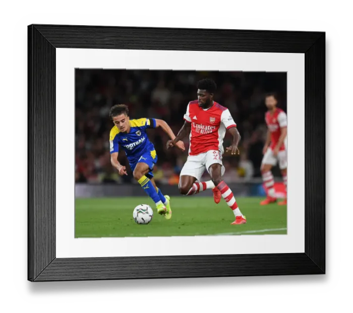 Framed Print : Thomas Partey vs Ayoub Assal: Arsenal's Midfield Battle in Carabao Cup Clash Framed Print : Thomas Partey vs Ayoub Assal: Arsenal's Midfield Battle in Carabao Cup Clash