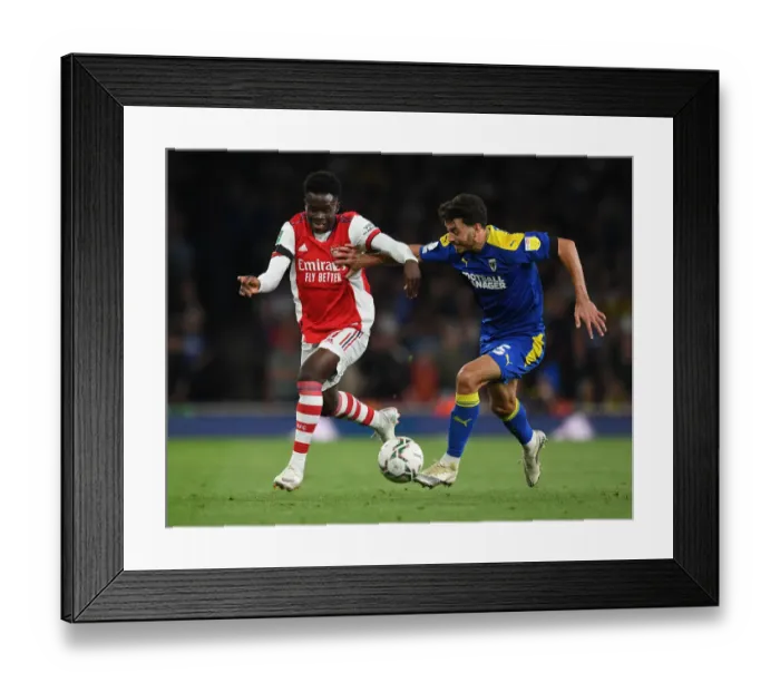 Framed Print : Bukayo Saka vs. Will Nightingale: A Carabao Cup Battle at Emirates Stadium Framed Print : Bukayo Saka vs. Will Nightingale: A Carabao Cup Battle at Emirates Stadium