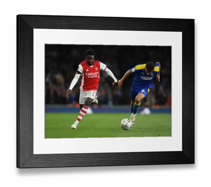 Framed Print : Arsenal's Bukayo Saka Faces Off Against AFC Wimbledon's Will Nightingale in Carabao Cup Clash Framed Print : Arsenal's Bukayo Saka Faces Off Against AFC Wimbledon's Will Nightingale in Carabao Cup Clash