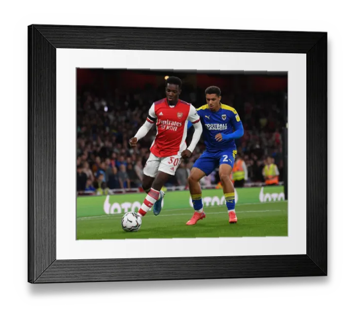 Framed Print : Arsenal vs AFC Wimbledon: Eddie Nketiah Thwarted by Henry Lawrence in Carabao Cup Clash