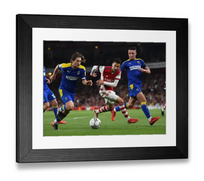 Framed Print : Arsenal's Martinelli Faces Off Against Wimbledon Duo in Carabao Cup Clash