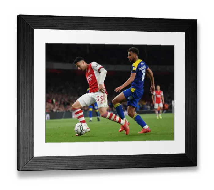 Framed Print : Martinelli Clashes with Guinness-Walker: Arsenal vs AFC Wimbledon in Carabao Cup