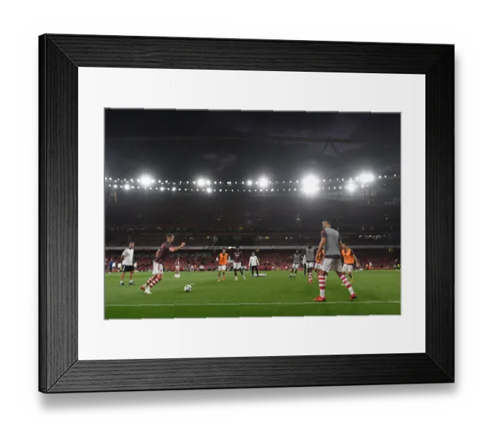Framed Print : Arsenal Players Warm Up Ahead of Carabao Cup Clash Against AFC Wimbledon