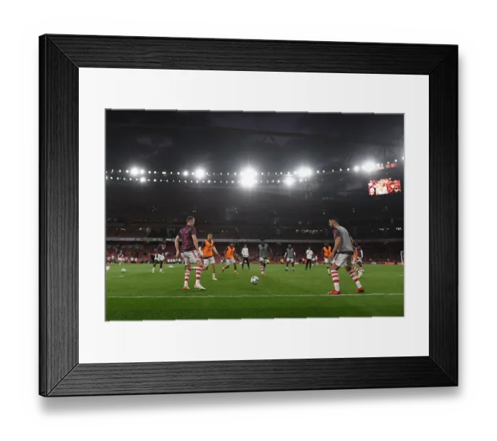 Framed Print : Arsenal Players Warm Up Ahead of Carabao Cup Clash vs. AFC Wimbledon