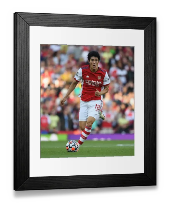 Framed Print : Arsenal's Tomiyasu in Action: Arsenal vs. Tottenham, Premier League 2021-22