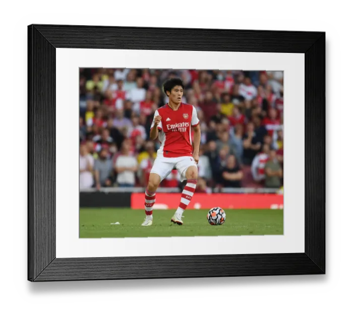 Framed Print : Arsenal's Tomiyasu in Action: Arsenal vs. Tottenham - Premier League 2021-22 (Emirates Stadium)