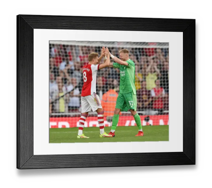 Framed Print : Arsenal's Ramsdale and Odegaard Reunite After Intense Arsenal v Tottenham Clash