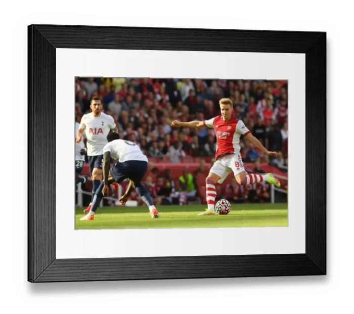 Framed Print : Arsenal's Martin Odegaard Faces Off Against Tottenham in Premier League Showdown