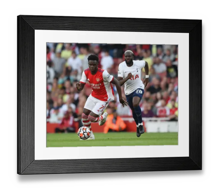 Framed Print : Saka vs. Ndombele: A Premier League Showdown at Emirates Stadium