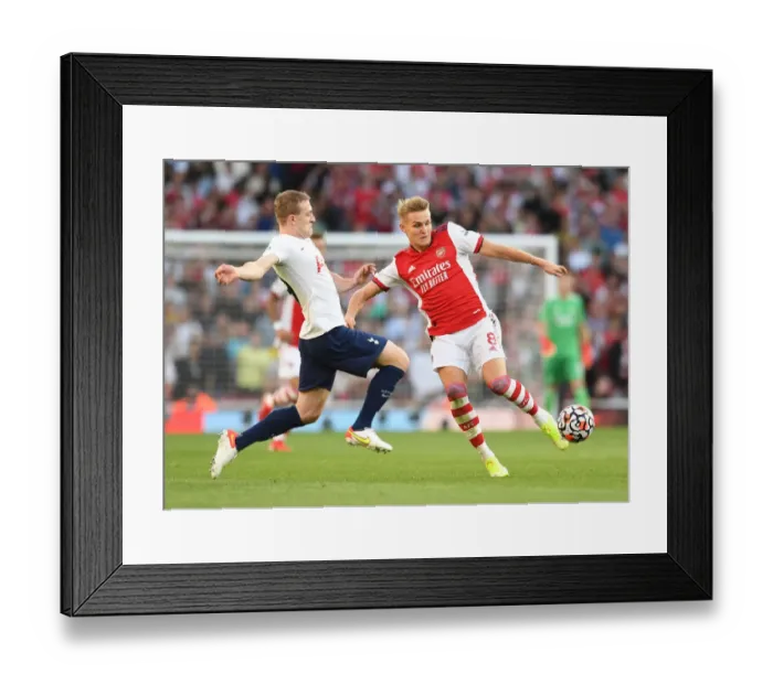 Framed Print : Arsenal vs. Tottenham: Intense Clash in the Premier League