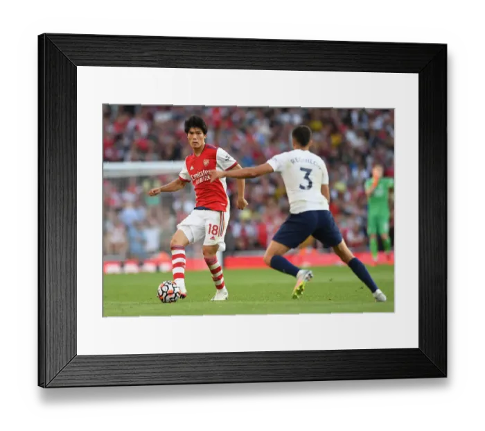 Framed Print : Tomiyasu's Standout Display: Arsenal's Derby Victory Over Tottenham, Premier League 2021-22