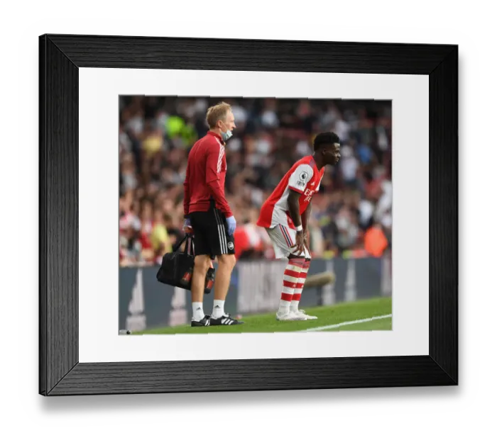 Framed Print : Arsenal's Bukayo Saka Receives Treatment: Arsenal v Tottenham Hotspur, Premier League 2021-22 Framed Print : Arsenal's Bukayo Saka Receives Treatment: Arsenal v Tottenham Hotspur, Premier League 2021-22