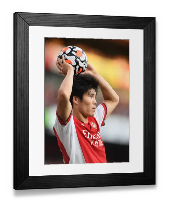 Framed Print : Arsenal vs. Tottenham Showdown: Tomiyasu in Action at the Emirates Stadium