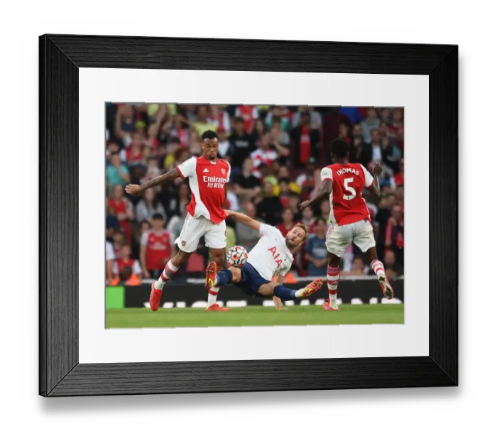 Framed Print : Arsenal vs. Tottenham: Magalhaes vs. Kane - Premier League Clash at Emirates Stadium