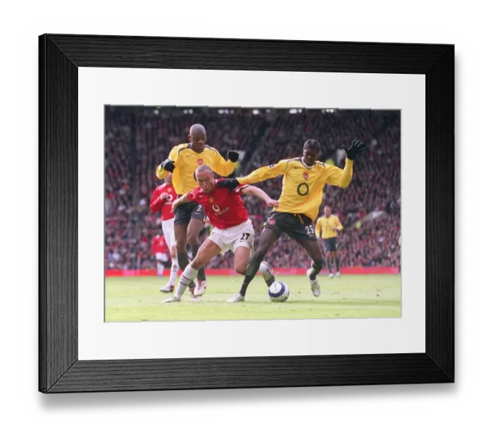 Framed Print : Emmanuel Adebayor and Abou Diaby (Arsenal) Mikael Silvestre (Man Utd) Framed Print : Emmanuel Adebayor and Abou Diaby (Arsenal) Mikael Silvestre (Man Utd)