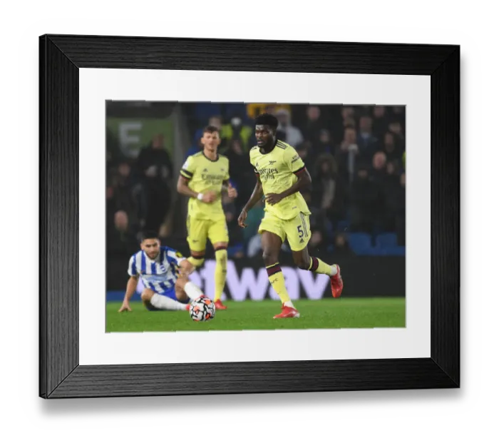 Framed Print : Thomas Partey: Arsenal's Midfield Maestro Shines in Premier League Clash Against Brighton & Hove Albion
