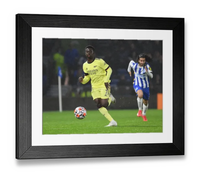 Framed Print : Bukayo Saka's Star-Studded Display: Arsenal's Victory over Brighton & Hove Albion, Premier League 2021-22