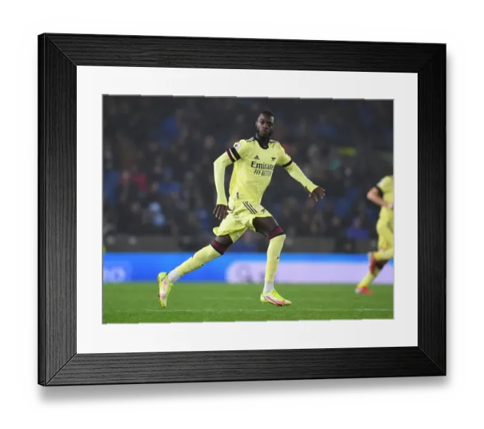Framed Print : Pepe Leads Arsenal's Premier League Charge Against Brighton & Hove Albion Framed Print : Pepe Leads Arsenal's Premier League Charge Against Brighton & Hove Albion