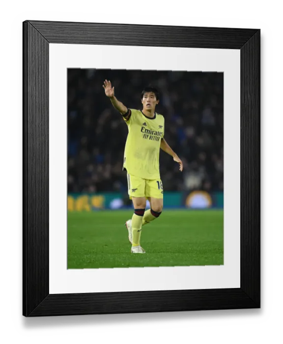 Framed Print : Arsenal's Tomiyasu in Action against Brighton in Premier League Clash Framed Print : Arsenal's Tomiyasu in Action against Brighton in Premier League Clash