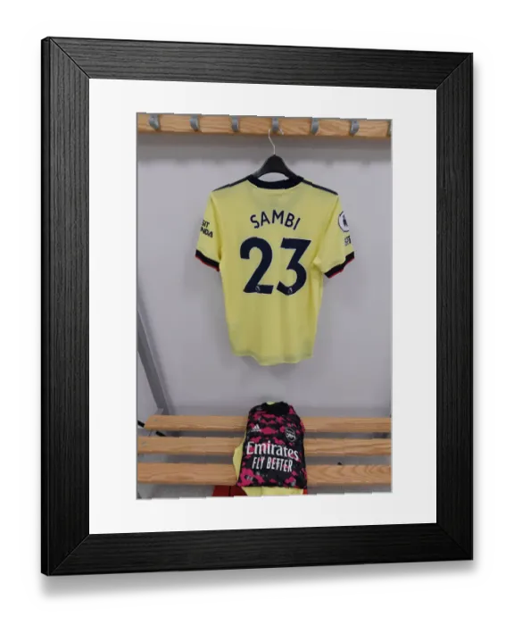 Framed Print : Arsenal's Saka: Pre-Match Routine in the Changing Room Before Brighton Clash