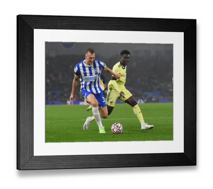 Framed Print : Bukayo Saka vs Dan Burn: Intense Clash in Brighton & Hove Albion vs Arsenal Premier League Match Framed Print : Bukayo Saka vs Dan Burn: Intense Clash in Brighton & Hove Albion vs Arsenal Premier League Match