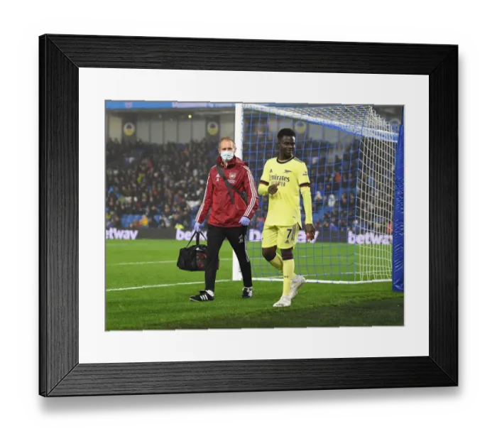 Framed Print : Arsenal's Jordan Reece Tends to Injured Bukayo Saka during Brighton vs Arsenal (2021-22) Framed Print : Arsenal's Jordan Reece Tends to Injured Bukayo Saka during Brighton vs Arsenal (2021-22)