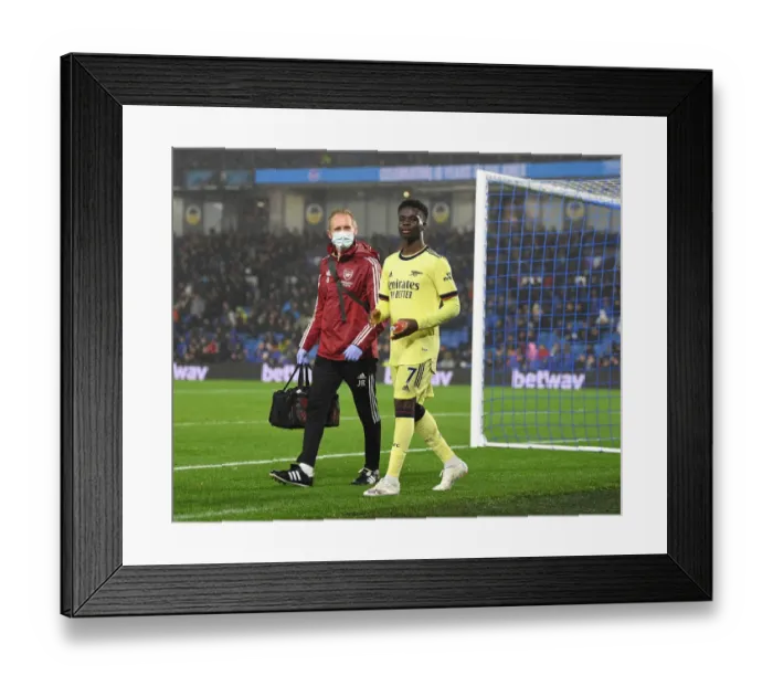 Framed Print : Arsenal: Jordan Reece Tends to Injured Bukayo Saka during Arsenal vs Brighton (2021-22) Framed Print : Arsenal: Jordan Reece Tends to Injured Bukayo Saka during Arsenal vs Brighton (2021-22)