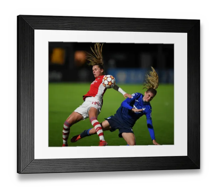 Framed Print : Arsenal vs. Hoffenheim: A Fierce Battle in the UEFA Women's Champions League
