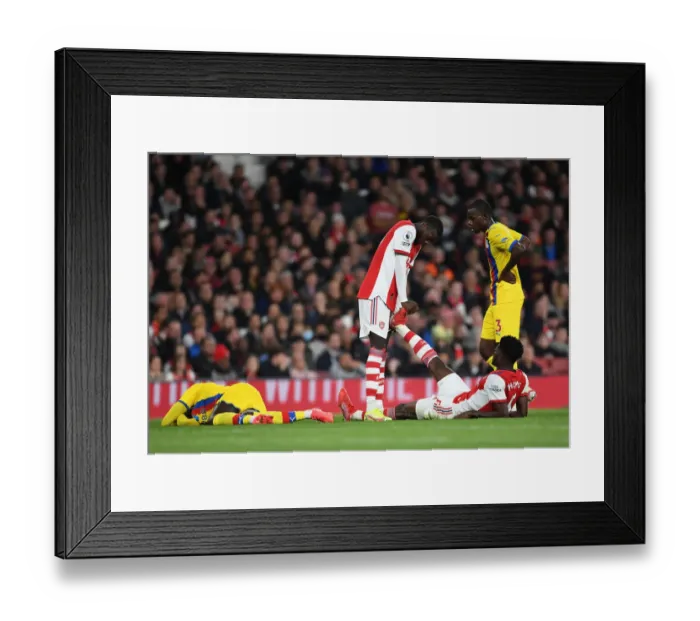 Framed Print : Comrades in Arms: Pepe Consoles Injured Partey on the Arsenal Field (2021-22)