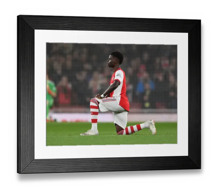 Framed Print : Arsenal's Bukayo Saka Takes a Knee during Arsenal v Crystal Palace, Premier League 2021-22