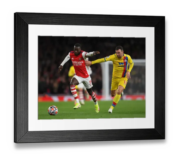 Framed Print : Arsenal's Pepe Clashes with Crystal Palace's McArthur in Premier League Showdown