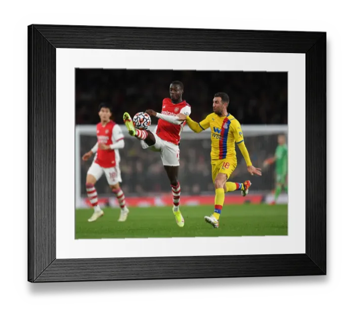 Framed Print : Arsenal vs Crystal Palace: Nicolas Pepe Faces Off Against James McArthur in Intense Premier League Clash