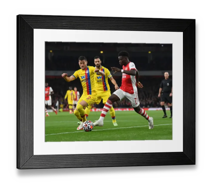 Framed Print : Arsenal's Bukayo Saka Faces Off Against Crystal Palace's Joel Ward in Premier League Clash Framed Print : Arsenal's Bukayo Saka Faces Off Against Crystal Palace's Joel Ward in Premier League Clash
